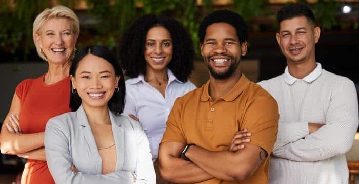 group of adults smiling with straight teeth