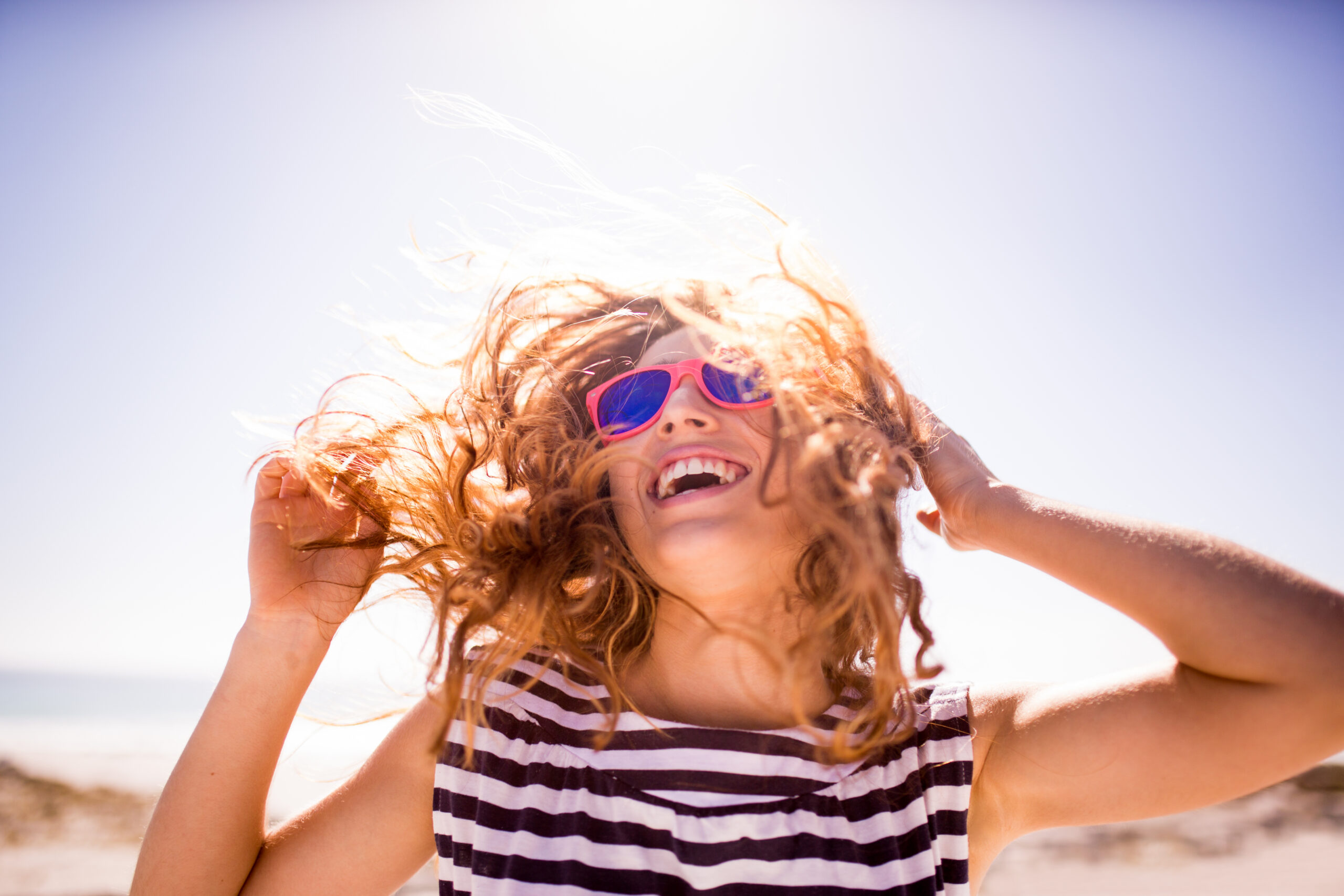 cheerful laughing woman on the beach 483203543 5760x3840 1