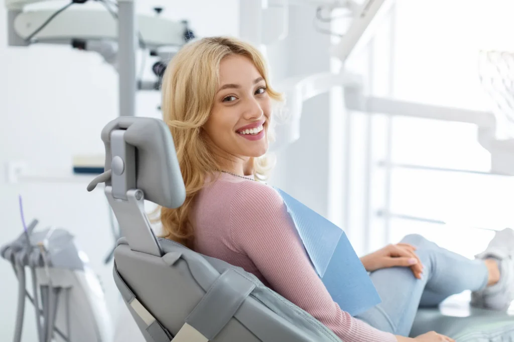 blonde patient in a dental chair smiling copy